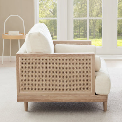 Julane cane armchair side view, featuring light fabric and natural cane backrest - CHITA Living