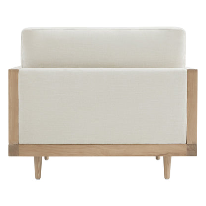 Julane cane armchair back view with light fabric and natural wood frame showcasing minimalist design - CHITA Living