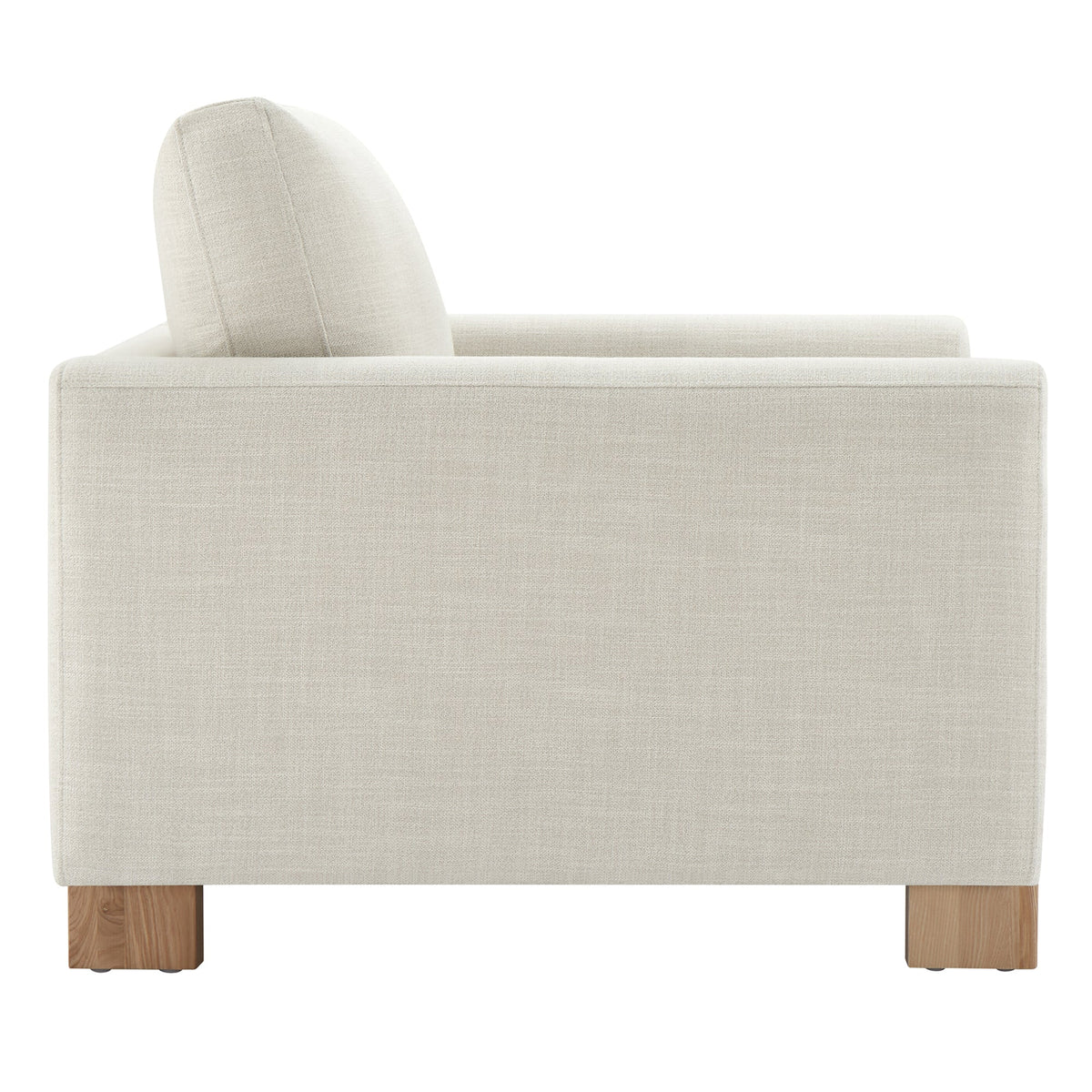 Side view of Keaton Armchair featuring soft fabric upholstery and solid wood legs - CHITA Living