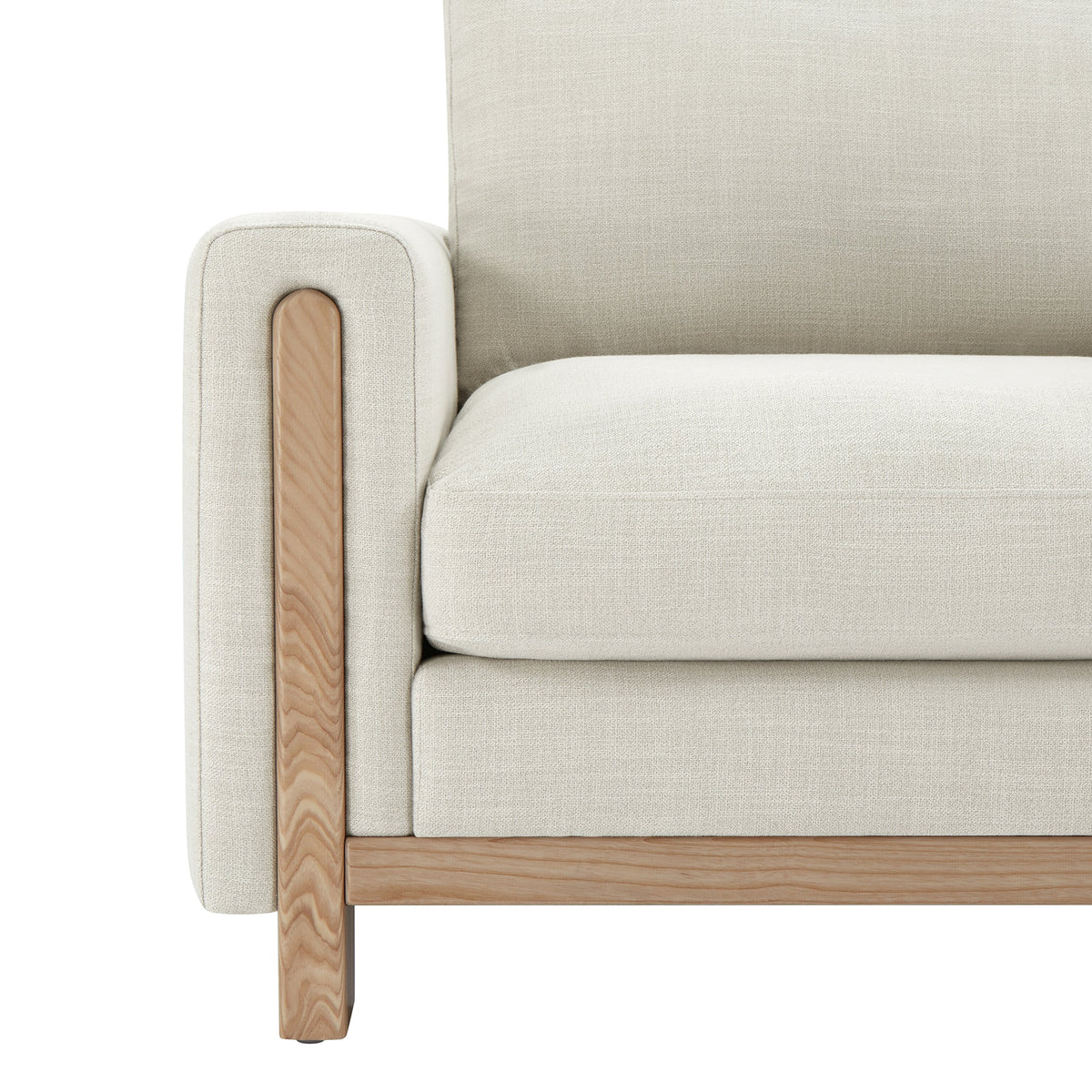 Light gray Keaton Armchair close-up with plush cushion and natural wood armrest - CHITA Living