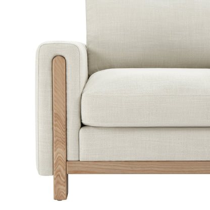 Light gray Keaton Armchair close-up with plush cushion and natural wood armrest - CHITA Living