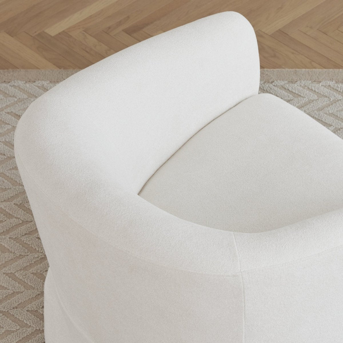 Top view of EllaGrace swivel armchair in soft white with rounded design - CHITA Living