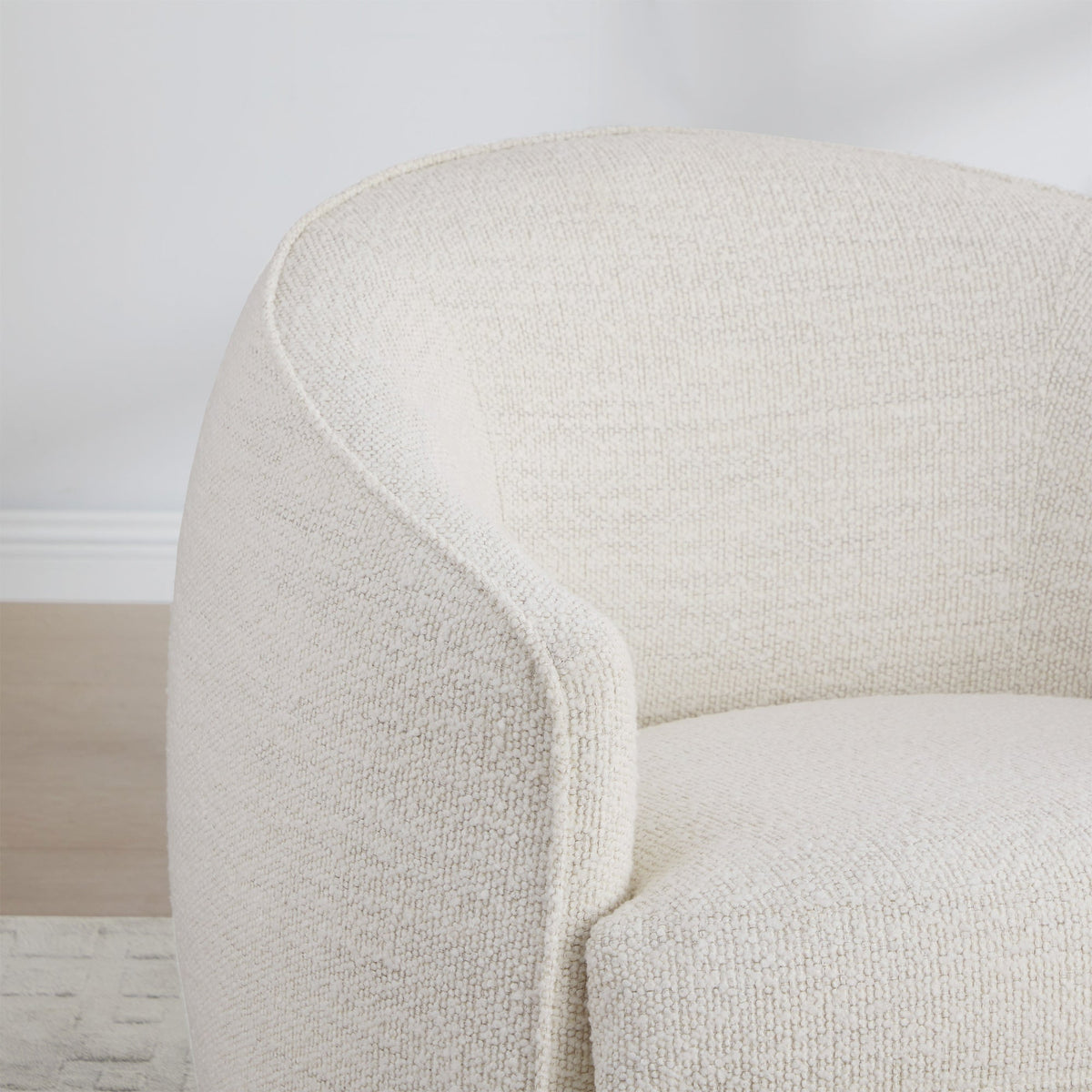 Close-up of cream textured Luke Modern Swivel Accent Chair showcasing soft rounded design - CHITA Living